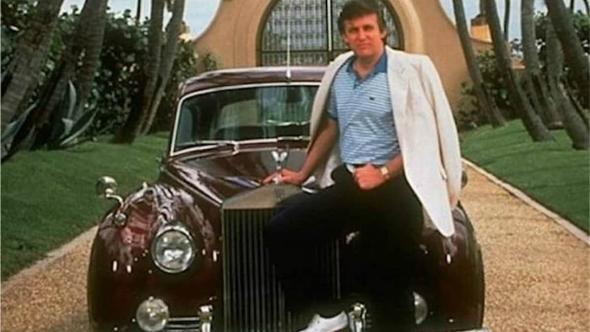 Donald Trump poses with his car.
Photo source: Insider