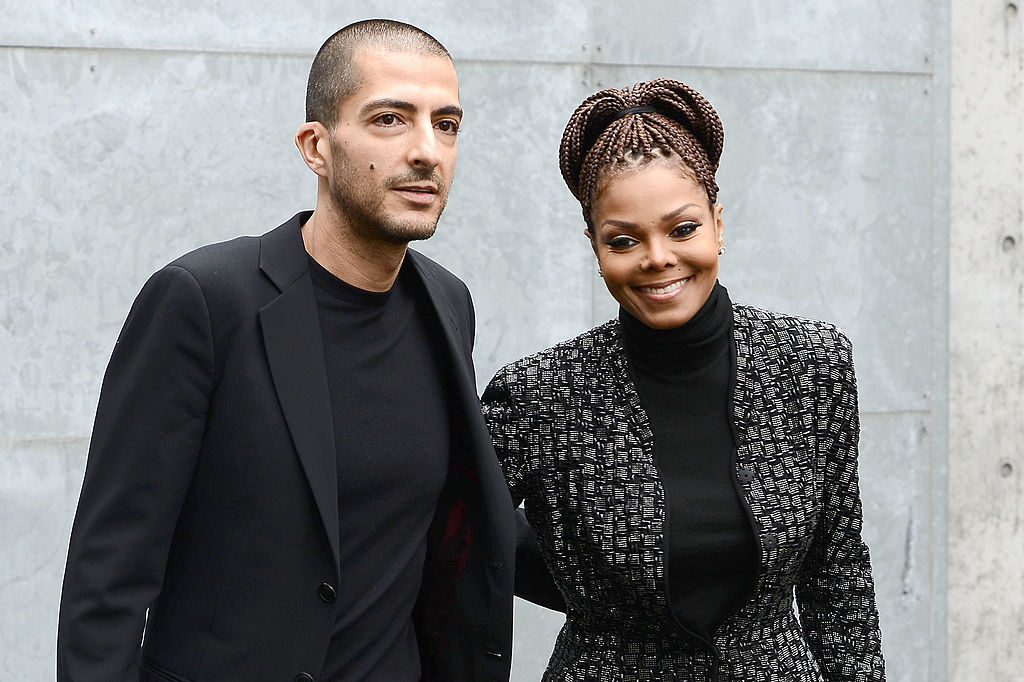 Wissam al Mana and Janet Jackson pose side by side at the Giorgio Armani fashion show in Milan, Italy.
