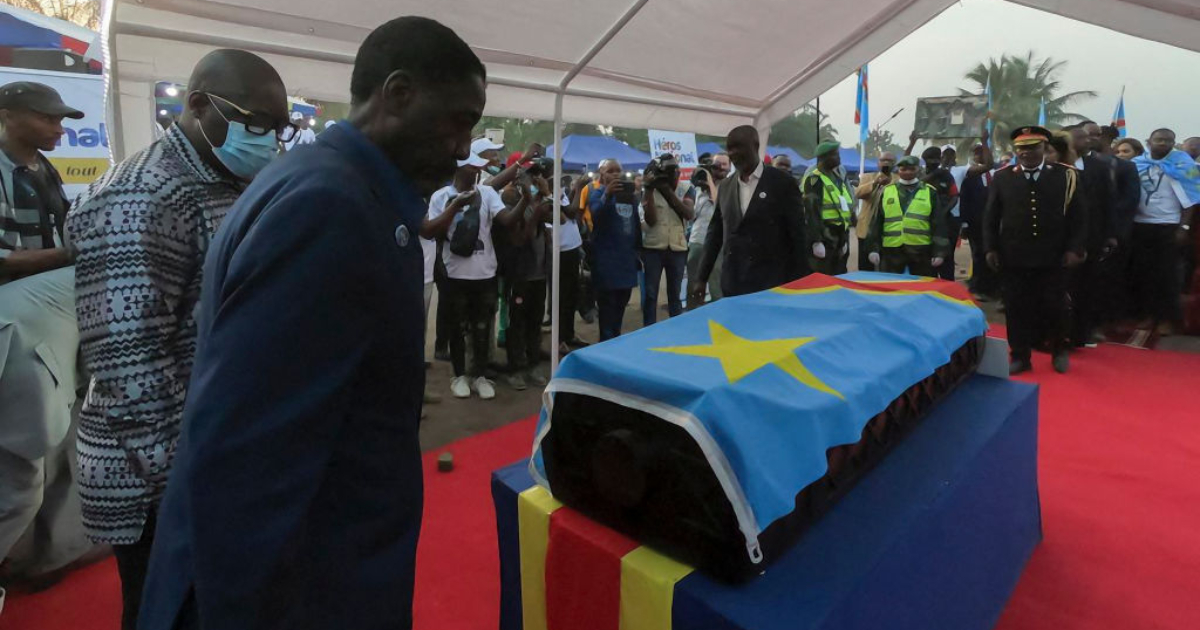 Patrice Lumumba's son pays his last respect to his coffin.