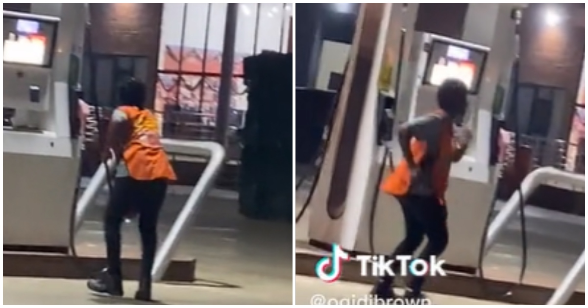 Young fuel pump attendant dancing on duty