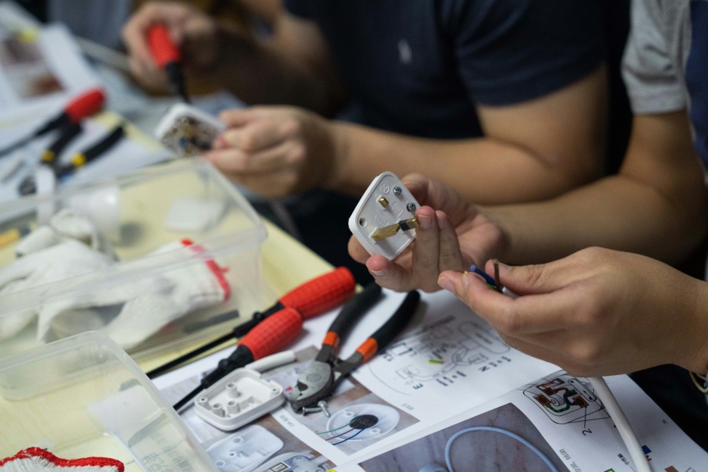 Savvy businesses have started offering crash courses in subjects like home repair and hairdressing, capitalising on a wave of people departing Hong Kong amid China's crackdown on dissent and strict pandemic rules