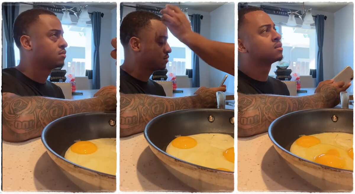 "You can't be useless in my kitchen": Lady breaks egg on her husband's head while cooking, video goes viral