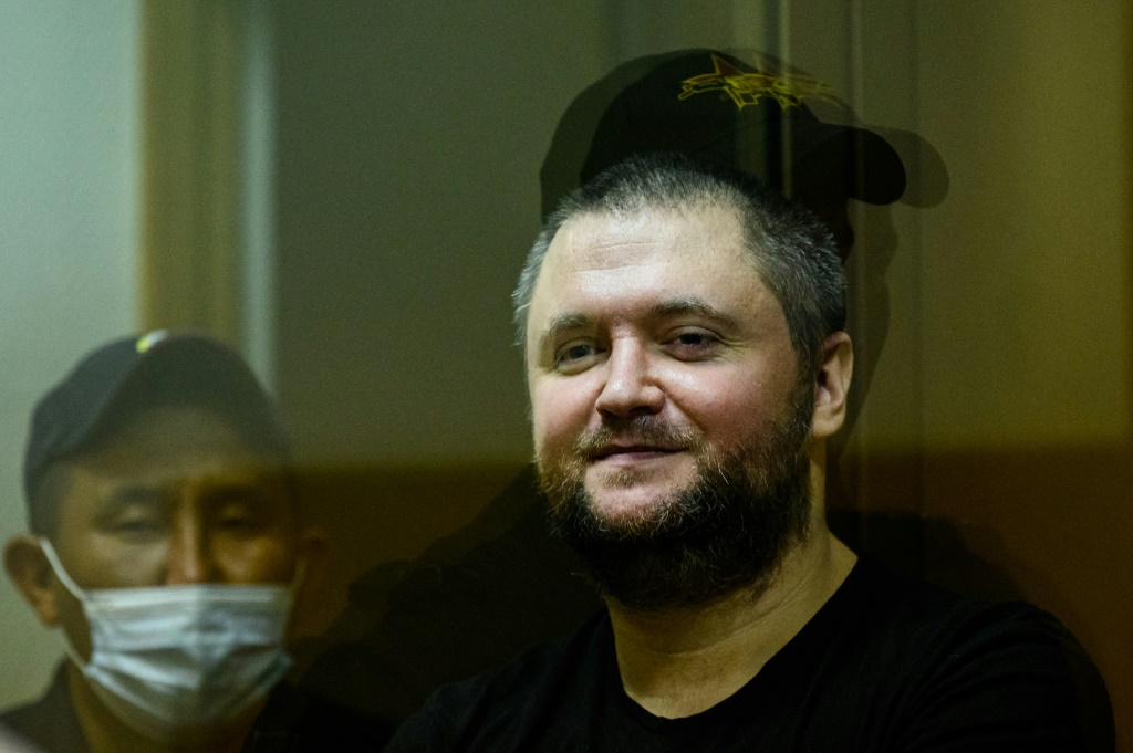 Former Russian policeman Vladimir Vorontsov, seen here in court in 2020, was jailed on Tuesday

, stands inside a defendants' cage during a court hearing in Moscow on July 2, 2020.Supporters of the 35-year-old, with blue eyes and a stocky build, say that the real reason for his arrest is his Police Ombudsman project, a series of linked social media accounts dedicated to protecting police officers' rights and exposing abuse by their higher-ups. His case has sparked a rare public outcry among police, a key pillar of President Vladimir Putin's rule, that could eventually spell trouble for the Kremlin, observers say.