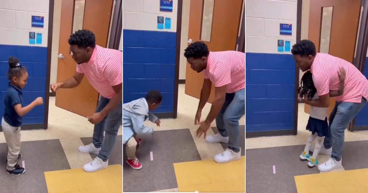 Teacher gives students special handshake