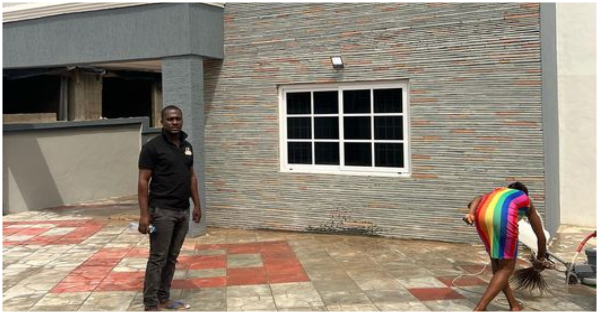 Zionfelix poses in front of his new house