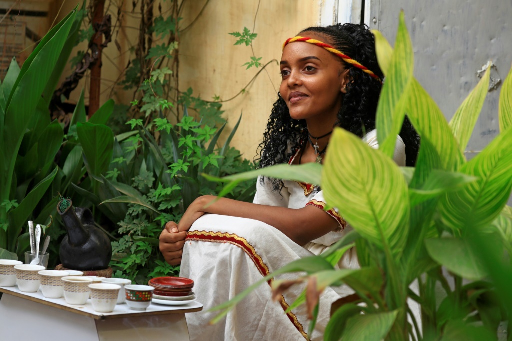 Ethiopian Reem Suhail, wearing a headband in the colours of Tigray's flag, takes part in the Ashenda celebrations