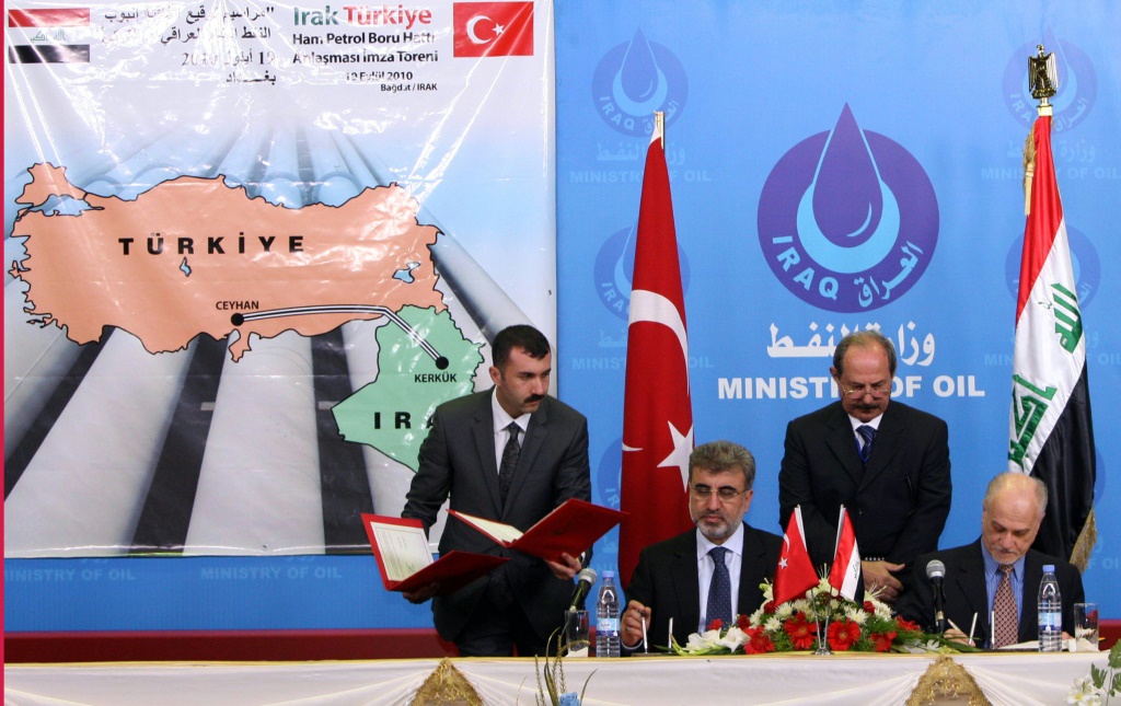 A photo from September 19, 2010 shows Turkish and Iraqi officials sign a deal to extend the use of the main pipeline linking Iraq's northern oilfields to the Mediterranean port of Ceyhan from where the crude is shipped to world markets