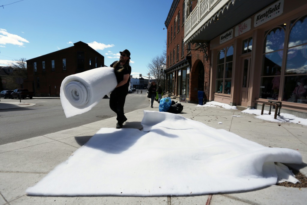 Special effects supervisor Mathieu Bissonnette-Bigras carries a roll of synthetic batting to create a winter snow scene