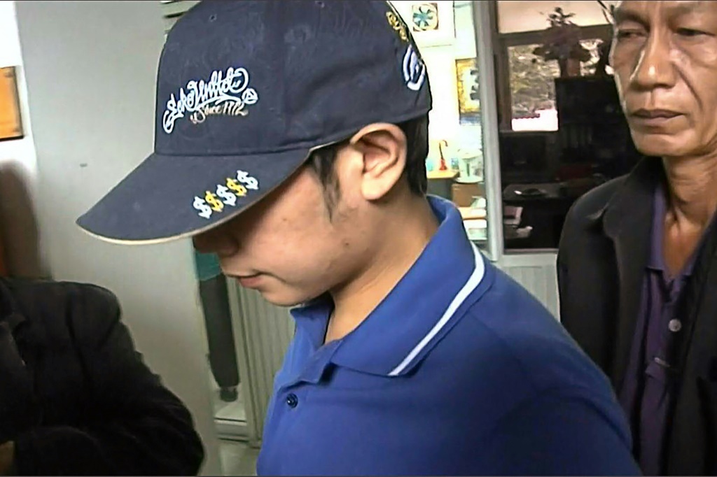 Red Bull heir Vorayuth 'Boss' Yoovidhya, seen entering Thong Lor police station in Bangkok in 2012, has become a symbol of what critics say is impunity for Thailand's super-rich