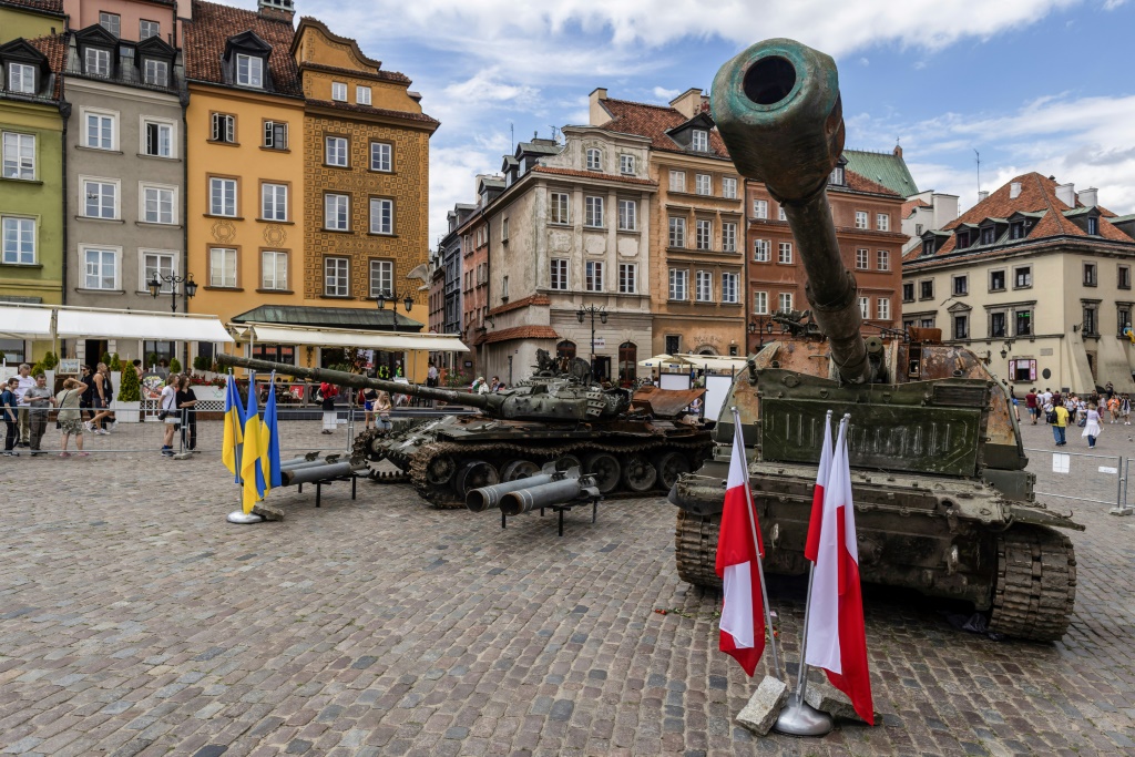 A Russian T-72 tank, left, and self-propelled gun have been placed on display in central Warsaw