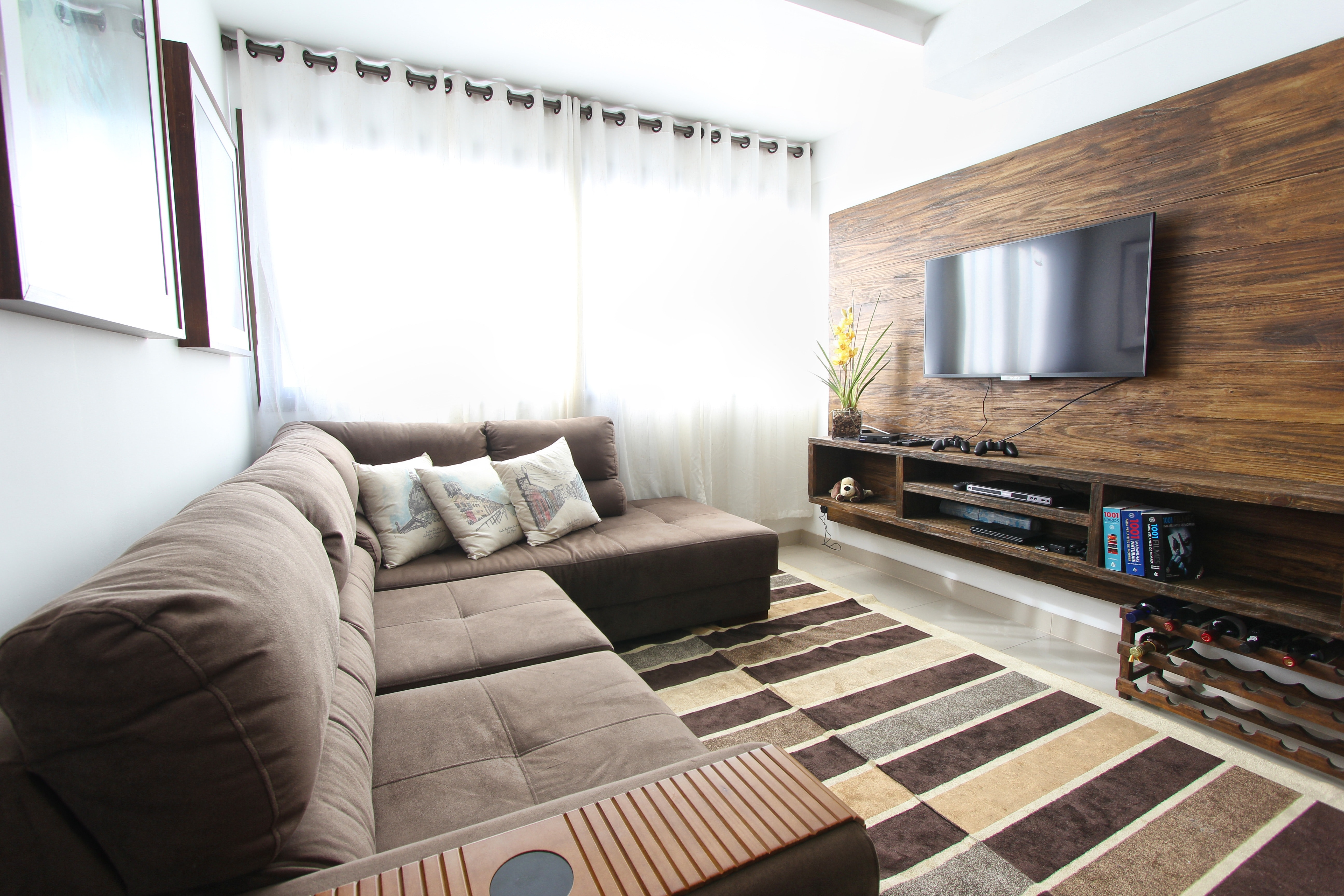 A smart TV in a brown-themed living room