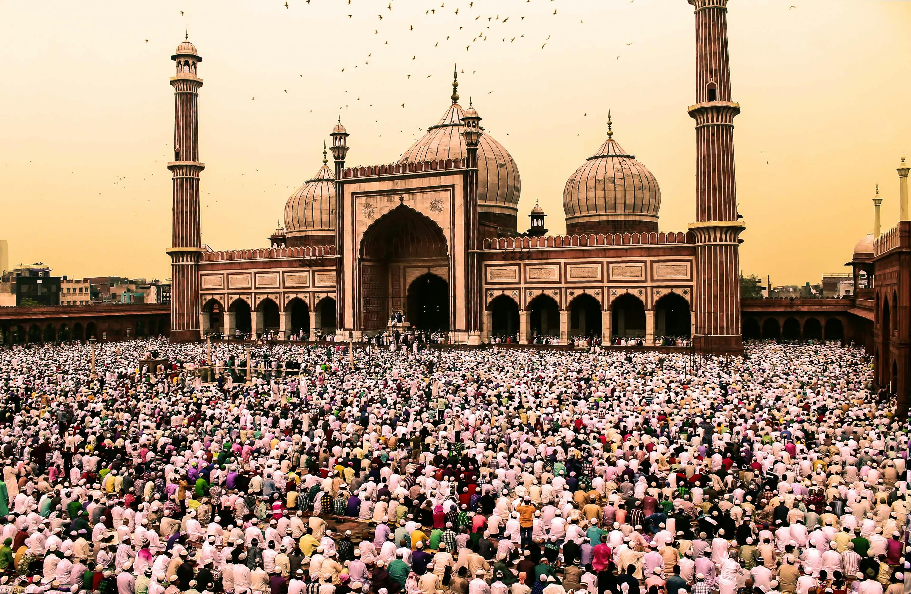 A crowd gathers at Jama Masjid during Eid al-Fitr