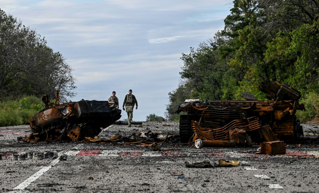 Destroyed armored vehicles litter the road in Balakliya, in the Kharkiv region