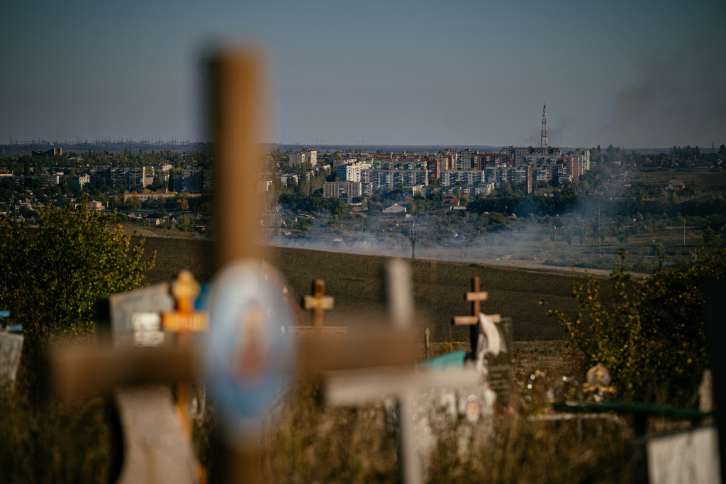 Smoke rises outside  Bakhmut, where the conflict has exposed divided loyalties