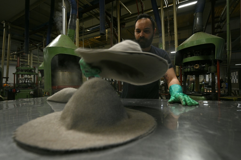 Artisans mould and shape the Fedoras, using quick gestures with surgical precision