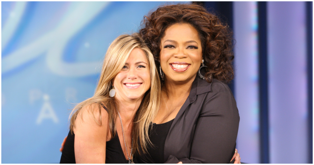 Jennifer Aniston (left) takes a picture with Oprah Winfrey (right)