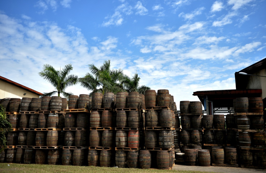 Wooden barrels used to age Havana Club rum are stacked up at the Havana Club's San Jose distillery in Cuba, in 2018