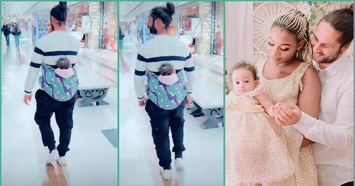 Obroni man melts hearts as he backs his baby with wrapper inside a mall