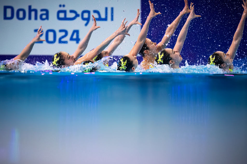 Japan's team competes in artistic swimming during the 21st World Aquatics Championships in Doha