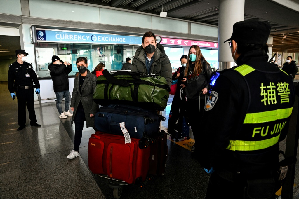 Passengers in the arrivals area at the Capital International Airport in Beijing on January 8, 2023