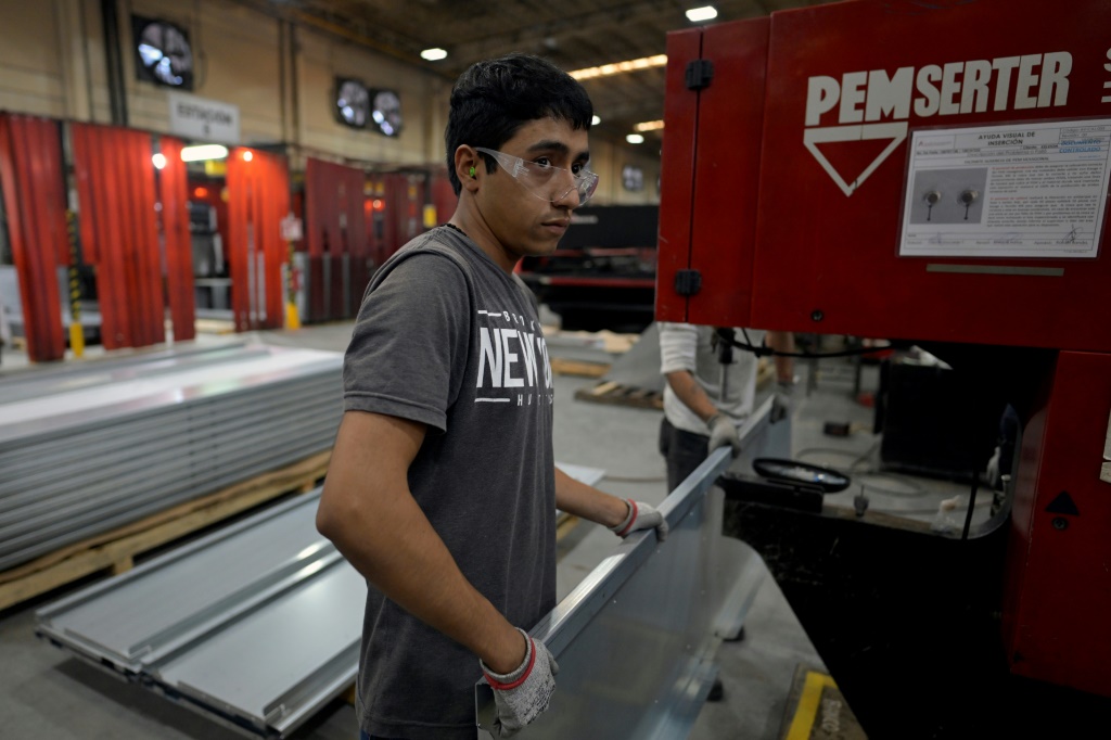 A worker at an Aztek Technologies metal parts plant on the outskirts of the Mexican industrial hub of Monterrey
