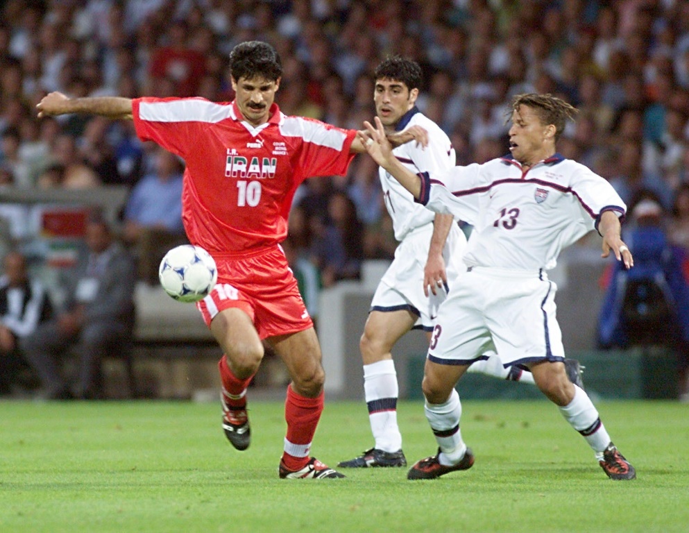 Iranian forward Ali Daei (L) fights for the ball with US midfielder Cobi Jones (R) during their 1998 World Cup clash
