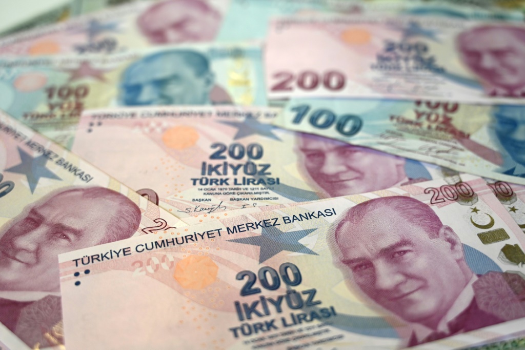 The Turkish lira fell against the dollar after a central bank hiked rates less than expected by markets
