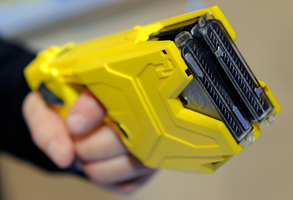 The non-lethal taser sends out an electric pulse through a web of mini-electric cables