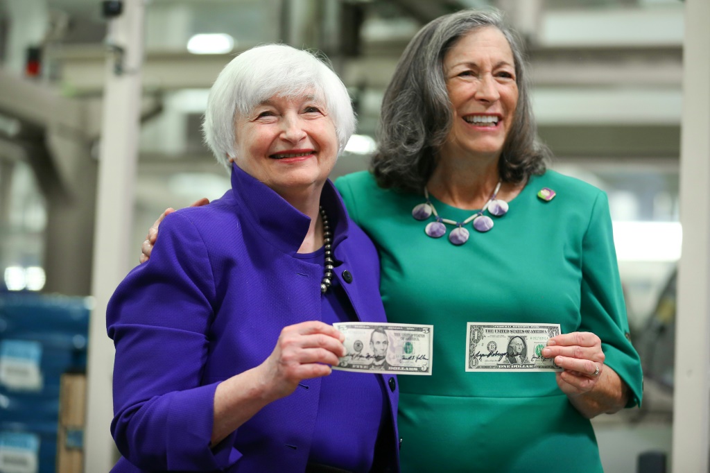 US Treasury Secretary Janet Yellen and Treasurer Marilynn Malerba hold notes with their signatures at the Bureau of Engraving and Printing Western Currency Facility on December 8, 2022 in Fort Worth, Texas