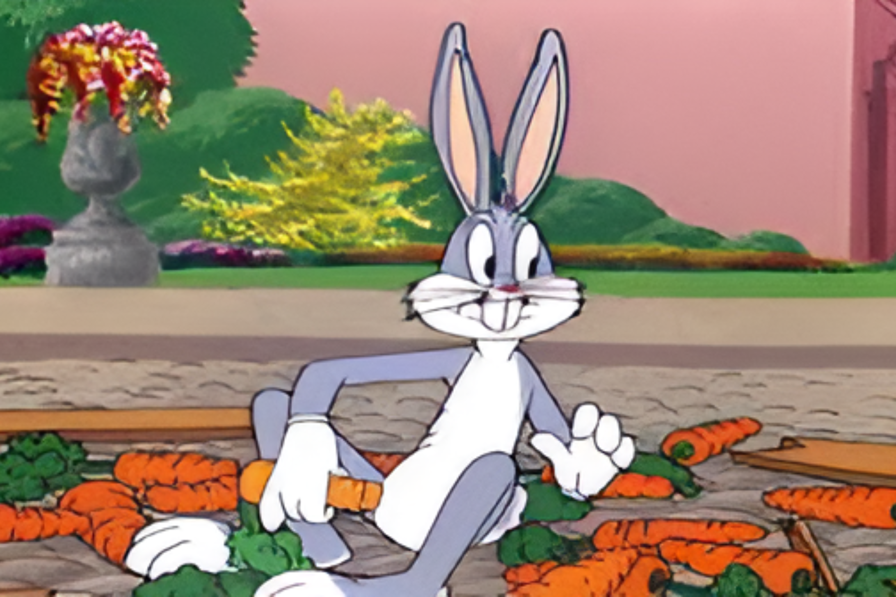 Bugs Bunny is sitting next to carrots