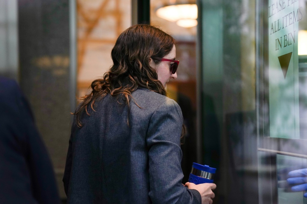 Sam Bankman-Fried's former girlfriend, Caroline Ellison, walks through security at Manhattan Federal Court on October 10, 2023, in New York