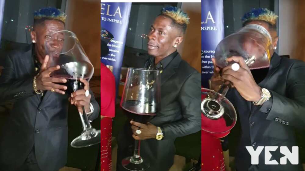 Shatta Wale cause stir at Efia Odo's wine shop opening with his big wine glass (video)