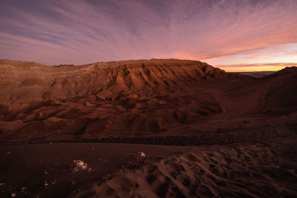 The sun sets on the Valle de la Luna in the Atacama Desert