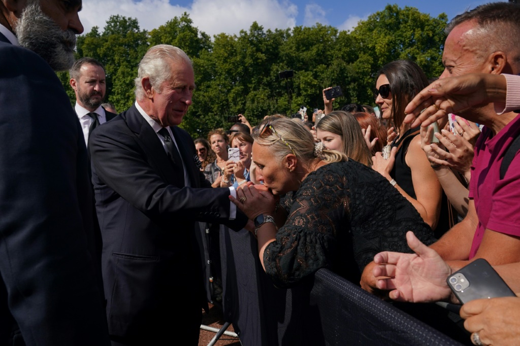 Crowds outside Buckingham Palace shouted "God Save the King" as he greeted them