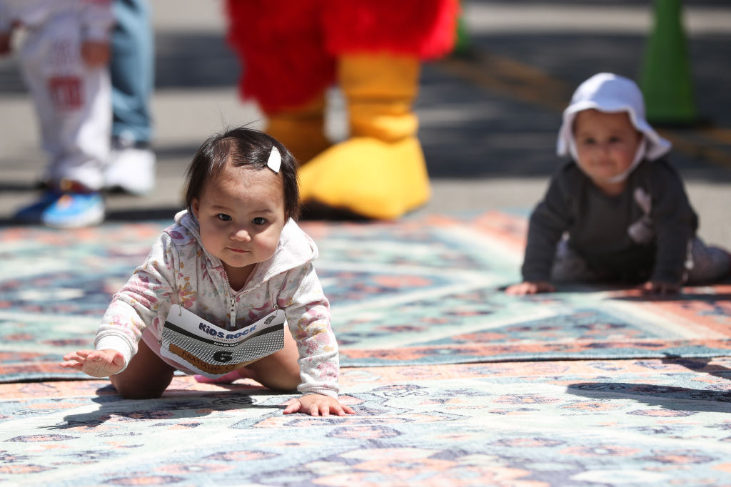 Babies compete in the Rock 'n' Roll diaper dash race in Nashville, Tennessee.