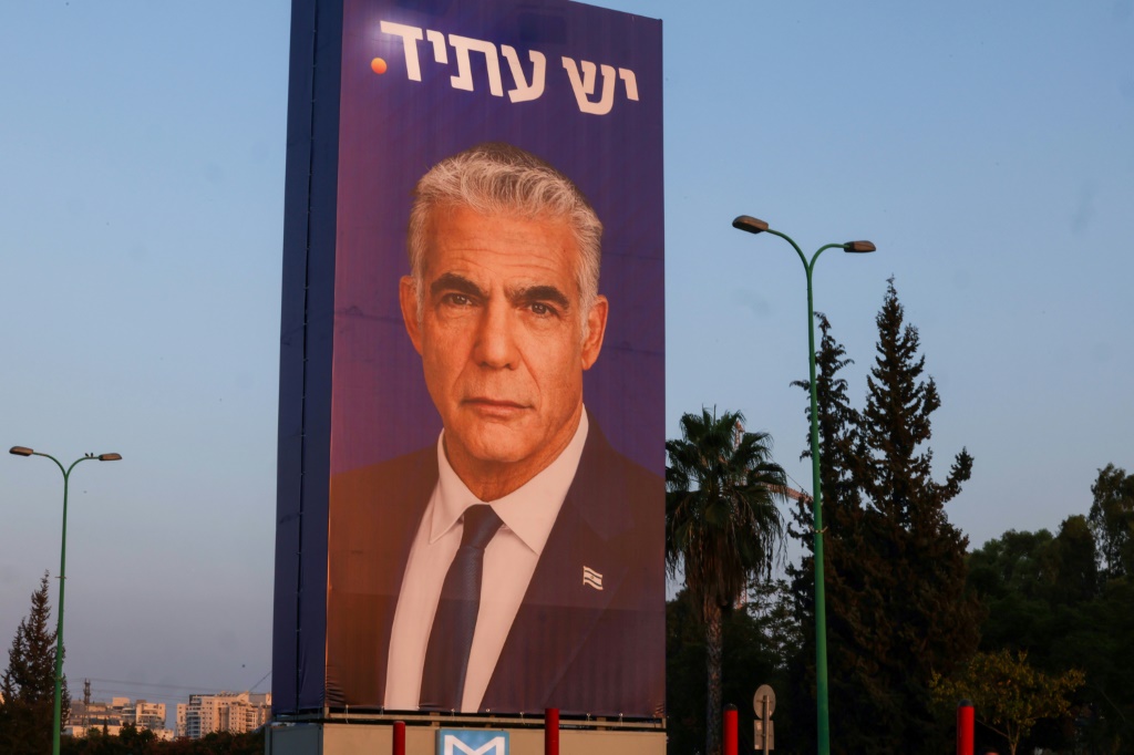A billboard for Yesh Atid party leader Yair Lapid, under the Hebrew spelling of the party name, in Tel Aviv this week