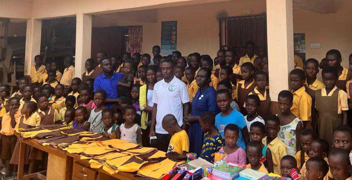 Pupils with torn uniforms & no footwears smile again as Ghanaian NGO blesses them with goods