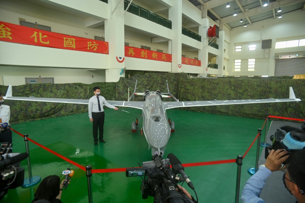 A staff member shows off a locally produced Albatross II UAV at the National Chung-Shan Institute of Science and Technology in Taichung on March 14, 2023