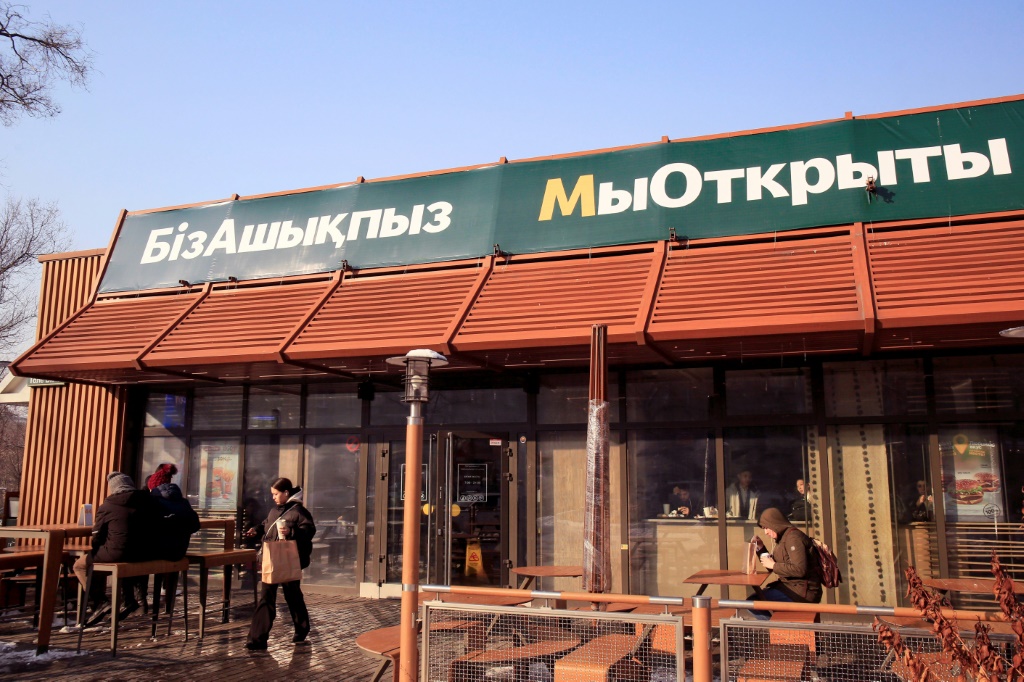 A yellow upper-case M inside the phrase "we are open" now appears at former McDonald's restaurants in Kazakhstan