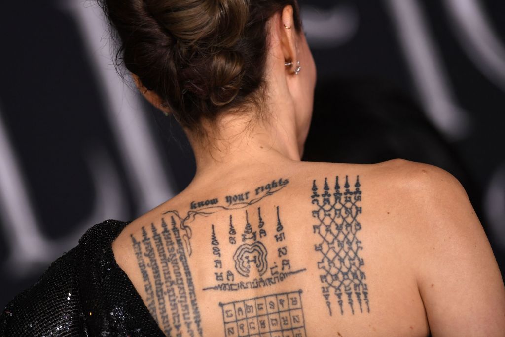 Angelina Jolie's tattoos are seen as she arrives for the world premiere of Disney's "Maleficent: Mistress of Evil" at the El Capitan Theatre in Hollywood