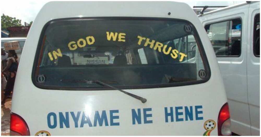 "In God we thrust" written behind a trotro