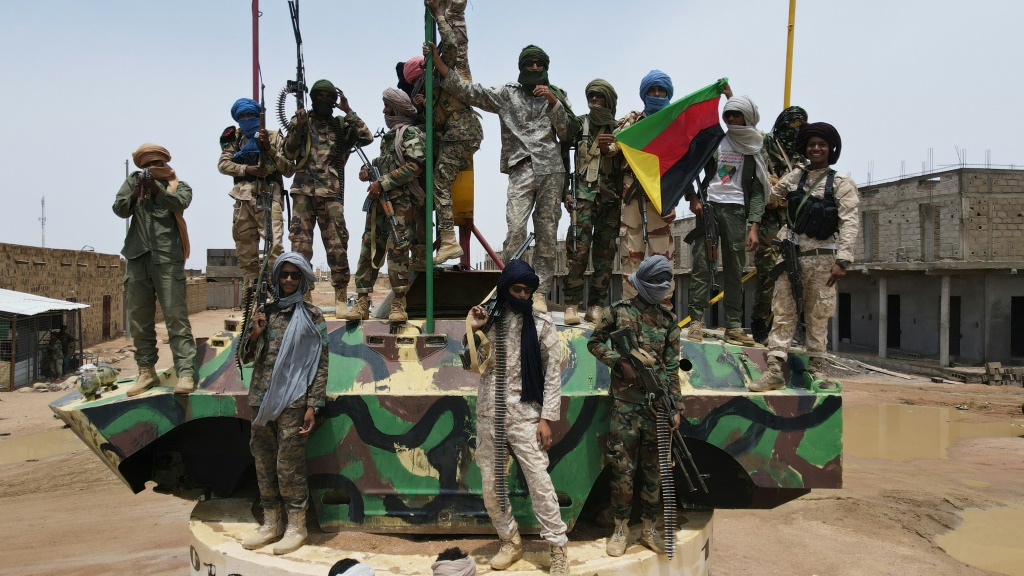 Fighters from the National Movement for the Liberation of Azawad (MNLA), part of the CMA alliance, pose for a picture during the August talks