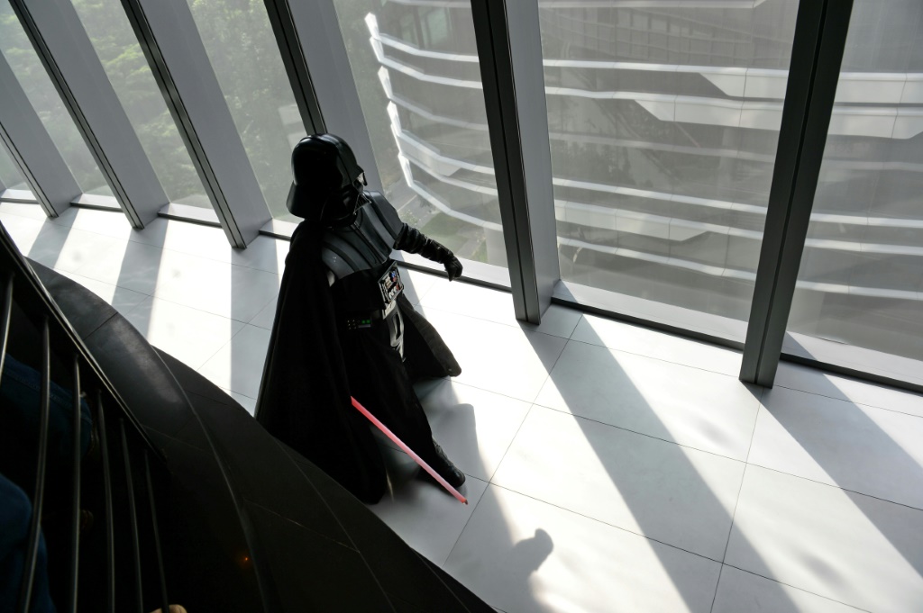 A staff member dressed as Darth Vader is seen at Lucasfilm's Sandcrawler building in Singapore in 2014