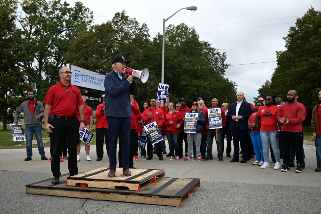 Biden addressed striking auto workers on the picket line through a bullhorn on Tuesday