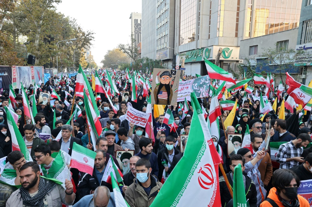 Iranians rally outside the former US embassy in Tehran to mark 43 years since supporters of the Islamic revolution took 50 embassy staff hostage