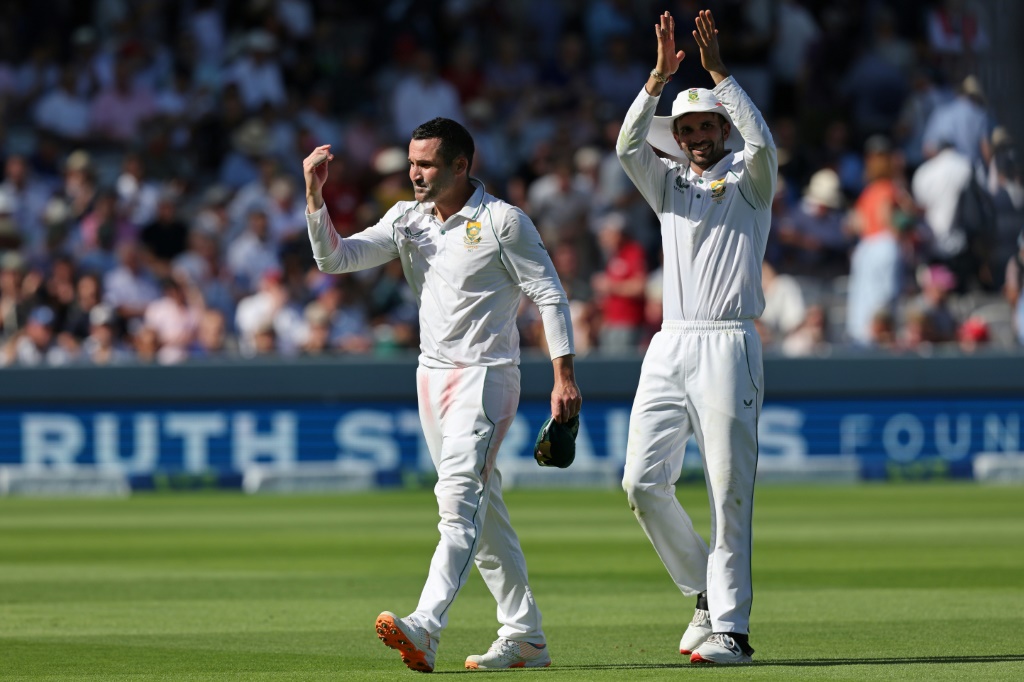 Winning feeling - South Africa captain Dean Elgar (L) and spinner Keshav Maharaj (R) celebrate after the Proteas' innings and 12-run win in the first Test at Lord's