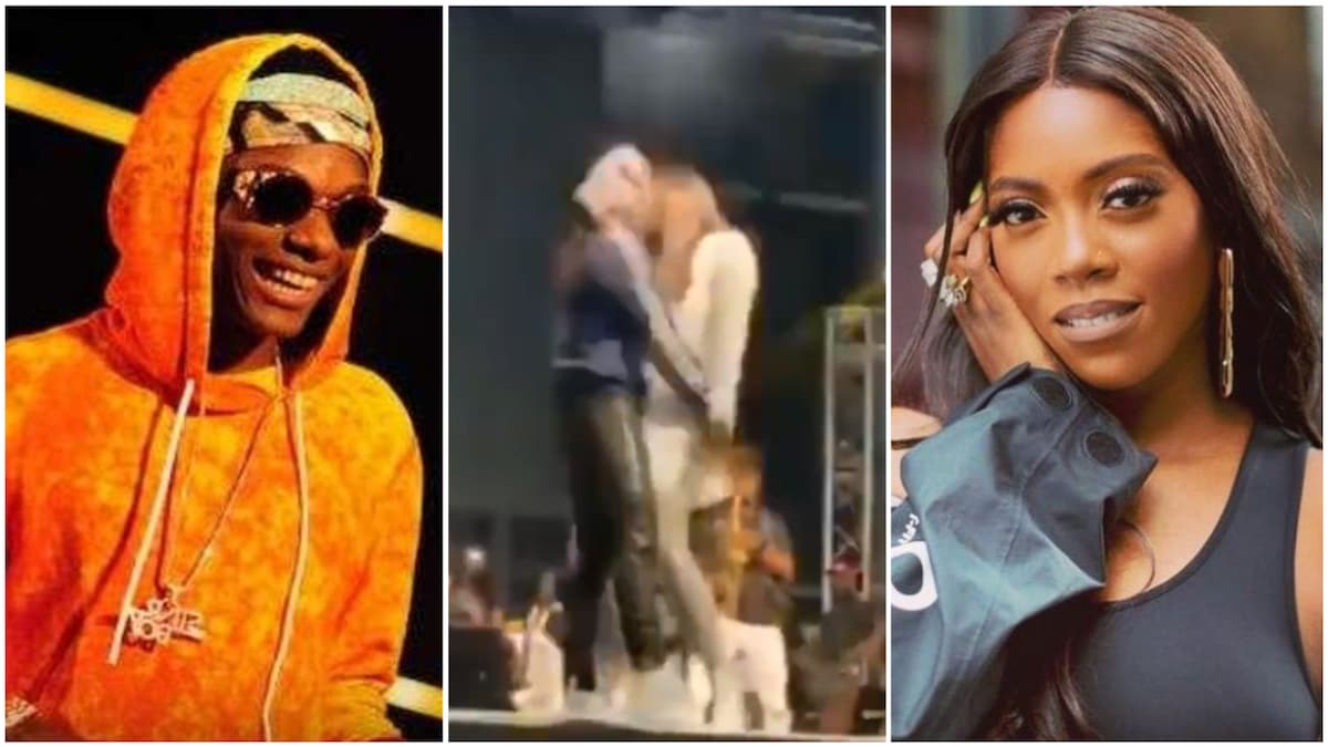 Tiwa Savage playfully slaps Wizkid's as he draws her closely by the waist (video)