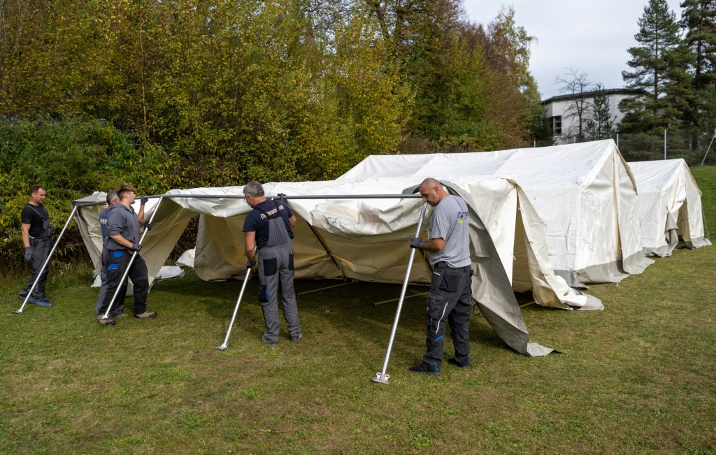 Workers assembles tents to house refugees in eastern Austria