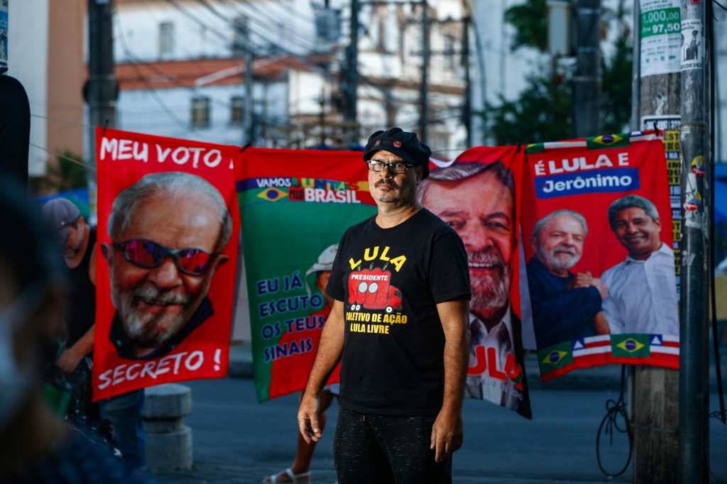 Messias Figueiredo, 56, is a well-known figure at left-wing protests -- instantly recognizable with his rectangular glasses and an ever-present red boom box emblazoned with Brazilian former president Luiz Inacio Lula da Silva's picture