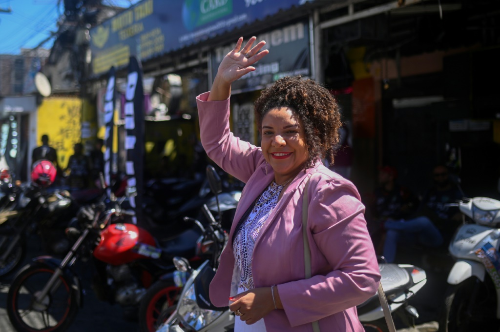 Rio de Janeiro state congresswoman and re-election candidate Renata Souza, of the Socialism and Freedom Party (PSOL), waves in the streets of Mare favela in Rio de Janeiro, Brazil, on September 02, 2022
